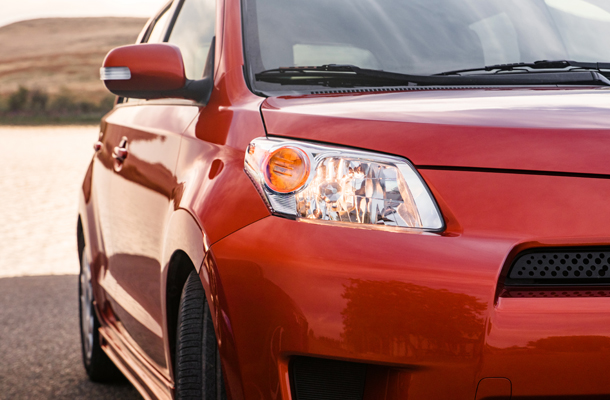 A red sedan looks factory new after having the frame straightened and paint done.